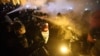 Hungary -- Protesters clash with police during a demonstration against the amendments to the labour code, dubbed "slave law" by oppositional forces, at the parliament building in Budapest, Thursday, Dec. 13, 2018